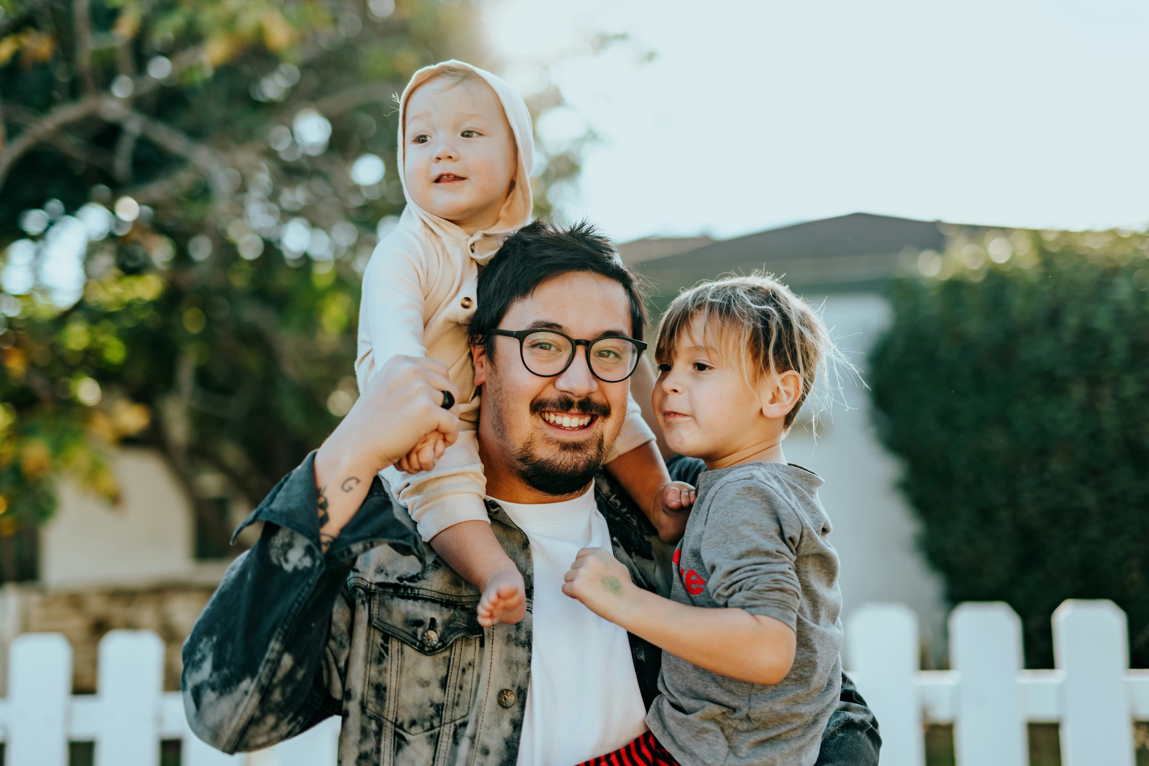 A father enjoying time with his children at home