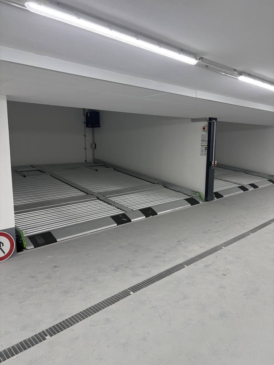 The underground garage, with a two-level stacker parking system