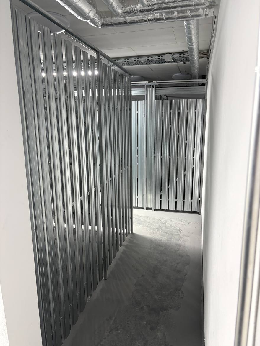 The basement, with individual storage compartments separated by metal slats